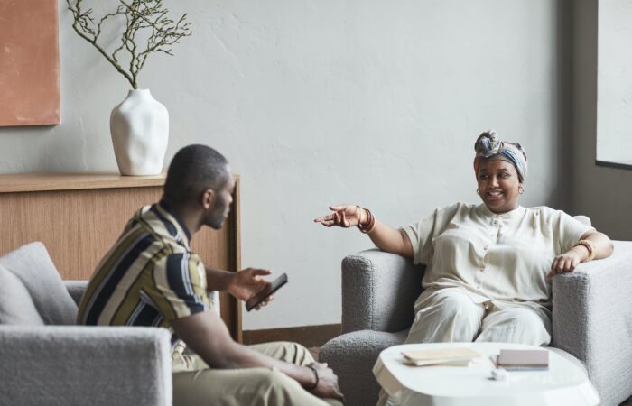 photograph of a man and a woman having a conversation